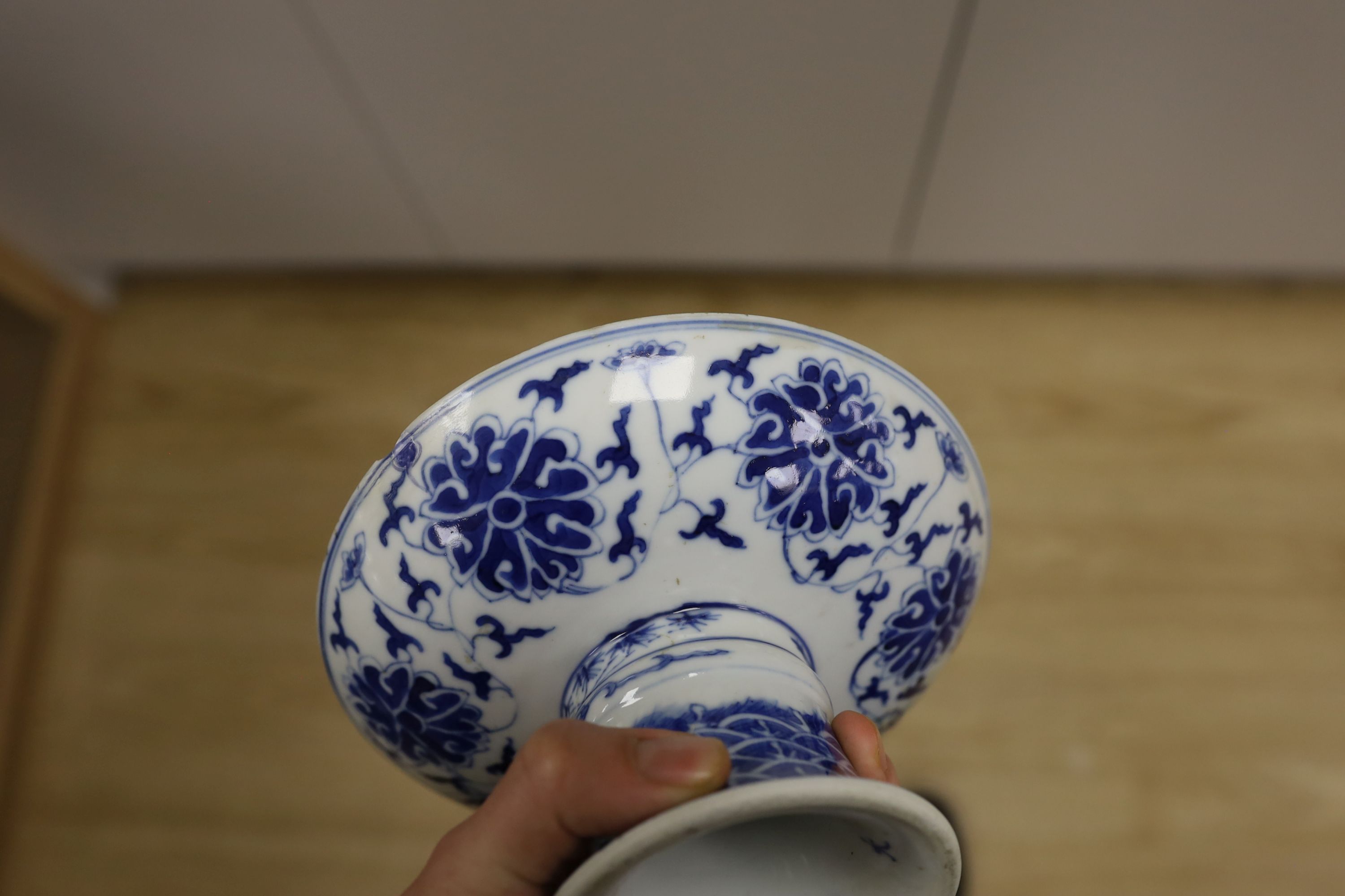A Chinese underglaze copper red ‘herder and goats’ vase, Kangxi six character mark but Republic period and a Chinese blue and white lotus stem dish, six character Guangxu mark and period, both damaged